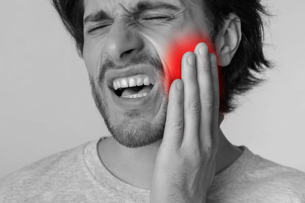 man with mouth pain