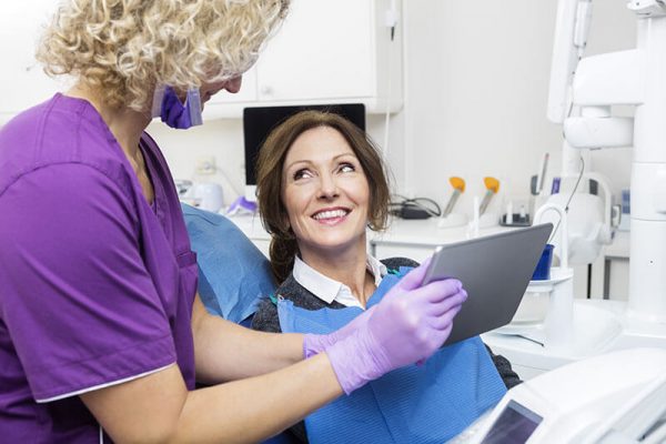 dentist showing a patient their x-rays