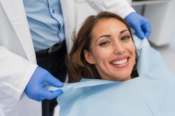 patient smiling in dental chair