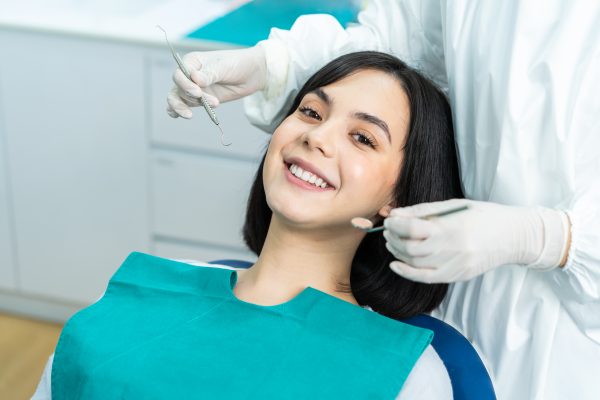 woman attends routine dental checkup